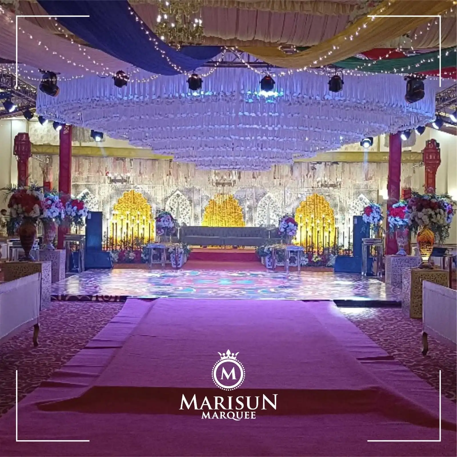 Bridal stage with chandelier and royal chairs